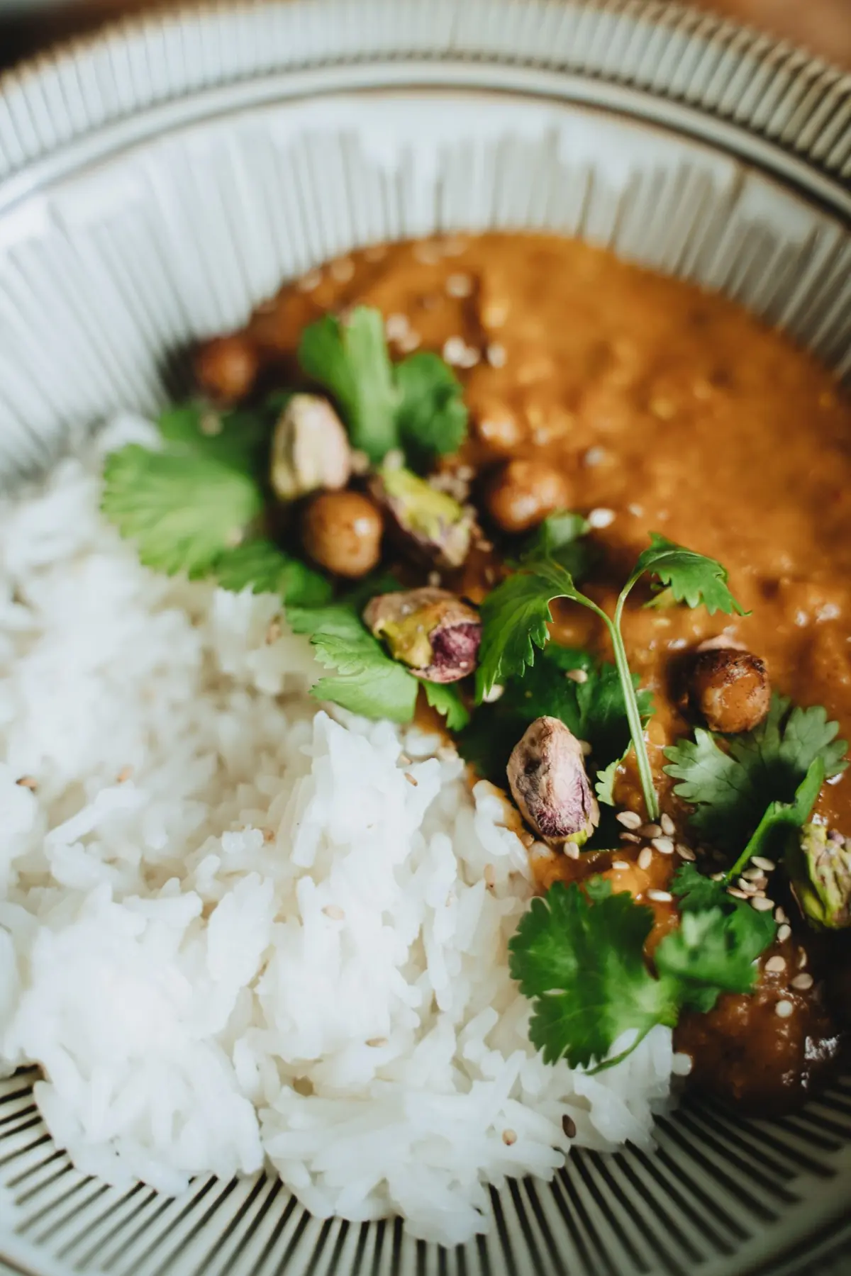 Chickpea curry served with rice and fresh coriander
